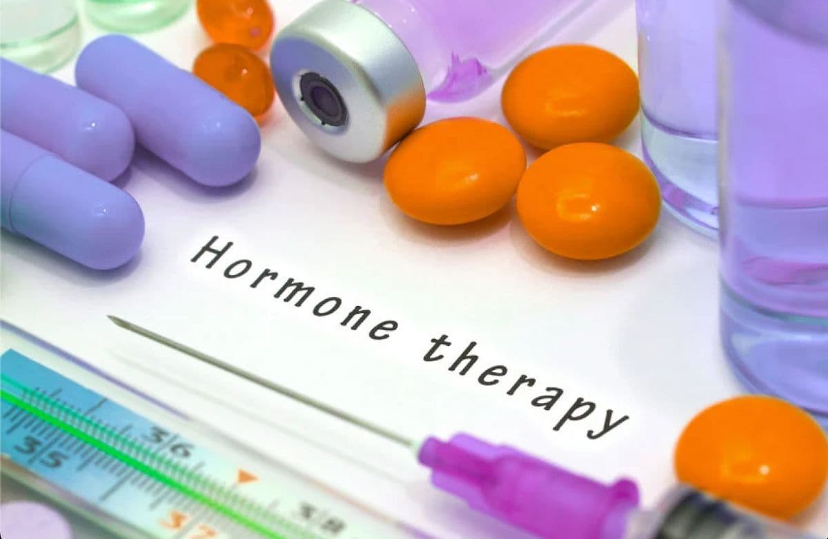 Hormone Therapy written on a paper surrounded by medications